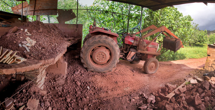 Red Dirt Pile In A Table Ready For Transformation And Tractor.