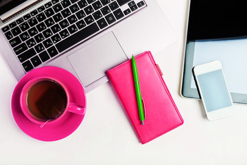 Office desk with laptop computer, tablet pc, planner, pen, mobil