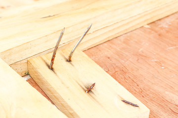 bent nail on wood
