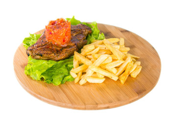 Grilled steak, french fries and lettuce
