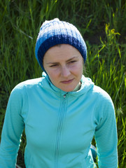 Portrait of a young girl in a knitted hat.