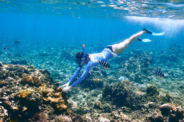 Woman with mask snorkeling