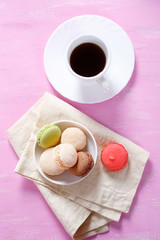 Macaroon in a bowl with coffee