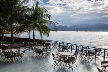 Cafe with tables on a background of the sea