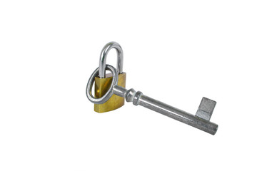 Silver vintage key hanging on the gold lock isolated on the white background