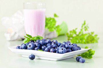  blueberry yogurt and ripe berries