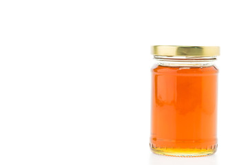 Honey jar isolated on white background