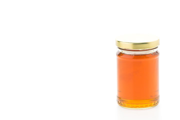 Fototapeta na wymiar Honey jar isolated on white background