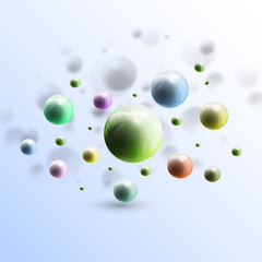 Three dimensional glowing color spheres on blue background