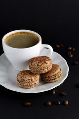 chocolate macaroon and a cup of coffee