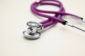 Closeup of a medical stethoscope, isolated on white background