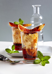 Italian dessert with wine Marsala, panettone and fried pear
