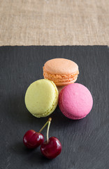 traditional french colorful macarons in a rows in a box