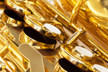 Obraz na płótnie Canvas Shiny golden keys of alto saxophone close-up view