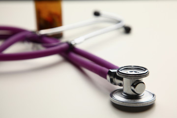 Closeup of a medical stethoscope, isolated on white background