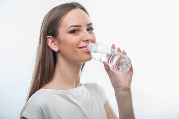 Beautiful healthy young woman is very thirsty 