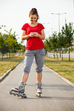 Sporty girl using phone