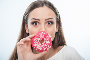 Beautiful young girl is playing with sweet food