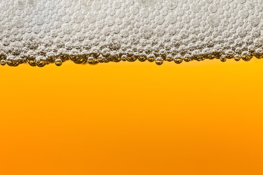 Beer with foam. Macro.