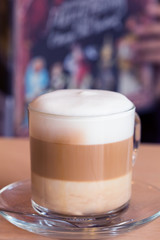 coffee latte with milk froth in cafe
