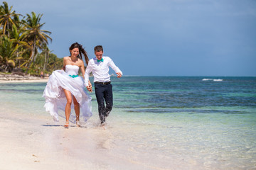 Beach couple walking on romantic travel.