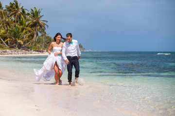 Beach couple walking on romantic travel.
