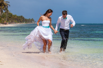 Beach couple walking on romantic travel.