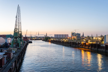 Hamburg at sundown. View to the City from the industrial estate harbor side