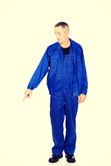 Fototapeta premium Repairman pointing down