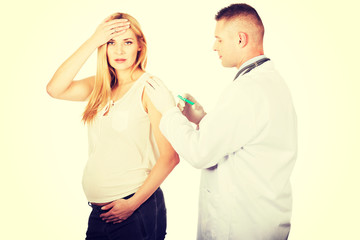 Pregnant woman getting vaccine