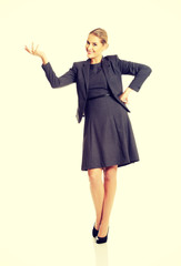 Happy businesswoman presenting copy space