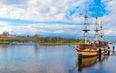 Fototapeta na wymiar View of river and dock with boats in ancient Russian city