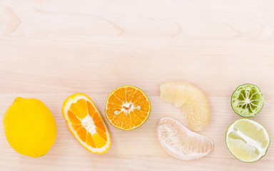 Mixed citruses fruit oranges, pomelo , lemon and lime on wooden