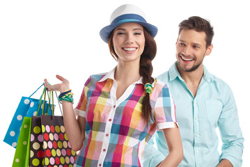 Couple with shopping bags. Studio shoot