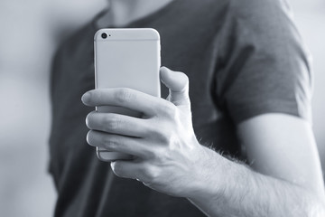 Man using smart phone close-up