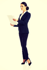 Businesswoman with paper notes
