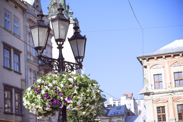 Fototapeta na wymiar Old lantern on square in the city