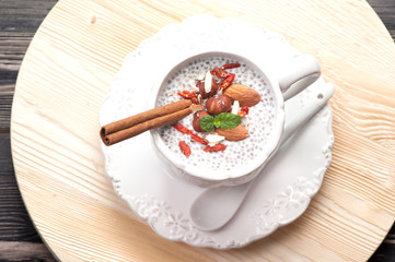 Chia seeds pudding with coconut milk and nuts. top view