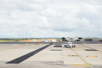 Commercial airplane on parking strip at airport