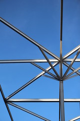 Fototapeta premium Steel roof pillars sky background.