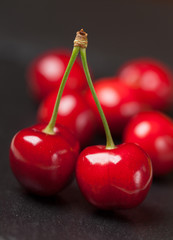 Red hherries on the black background
