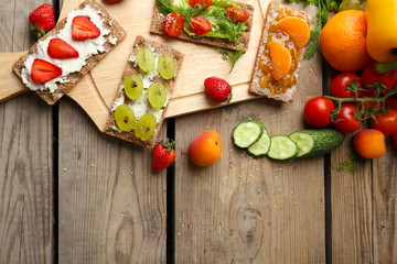 Still life with vegetarian sandwiches on wooden table