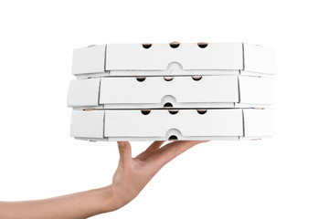 Hand holding pizza boxes isolated on white