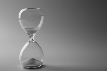 Hourglass on gray background