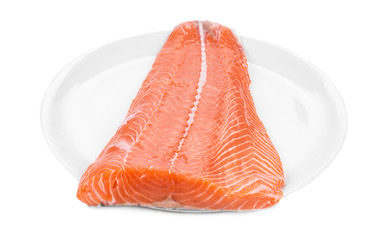 Raw salmon fillet on plate.