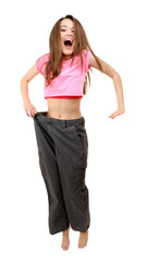 Young slim woman wearing too big pats isolated on white