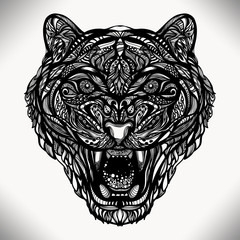 Fototapeta premium Figure vector wild animal tiger with a grin of decorative pattern of lines and dots. Can be used for printing, tattoos and jewelry for you. work of the author.