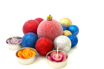 Christmas toys and candles on a white background