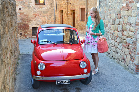 Girl And A Red Vintage Car On The Narrow Italian Street