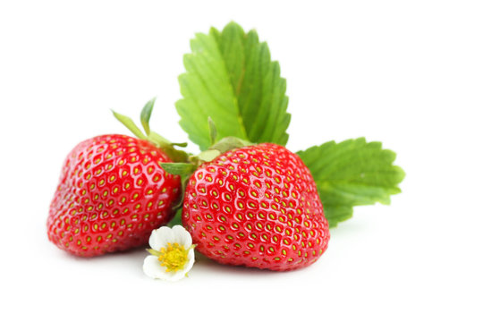 Strawberries berries with leaves isolated on white